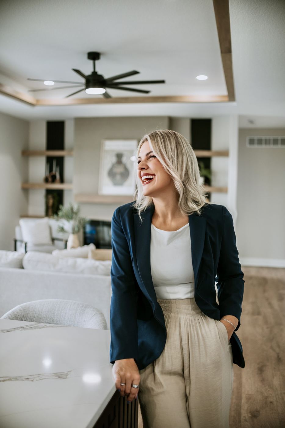 Senada laughing in a living room